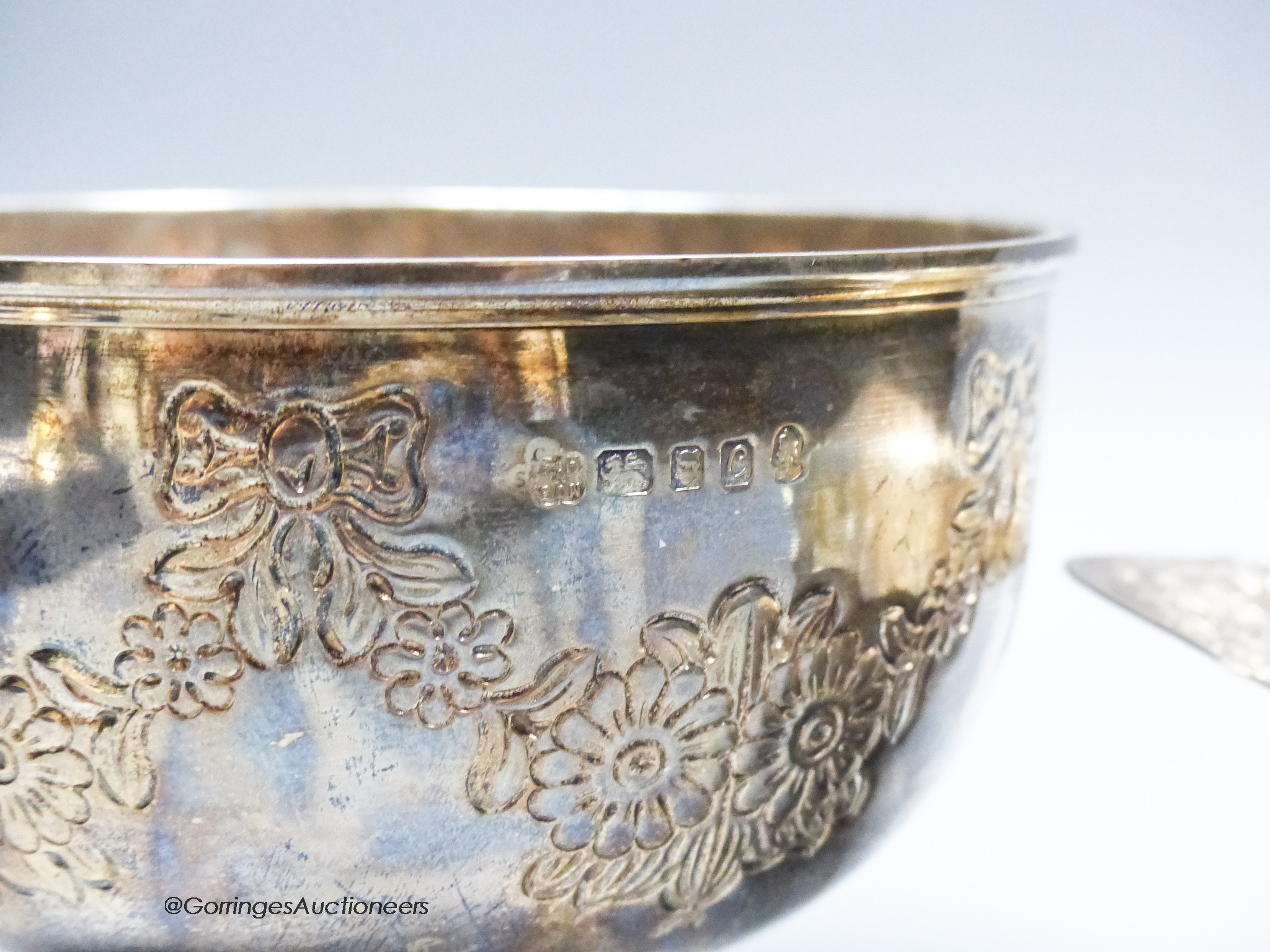 A late Victorian repousse silver two handled bowl, London, 1894, 16.8cm and a modern silver rose bowl, 14.5oz.